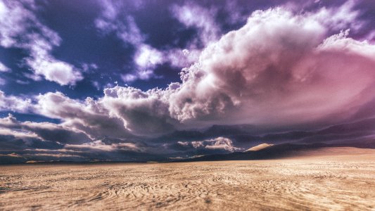 empty desert under gray couldy sky photo