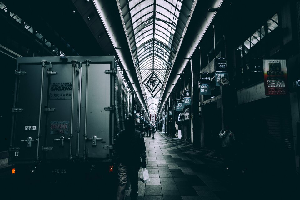 person walking beside truck