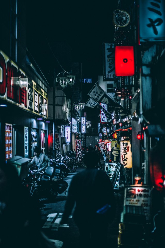 person standing between buildings