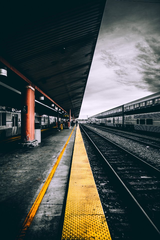 selective color photography of train railways