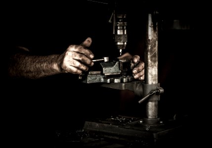 man using drill press