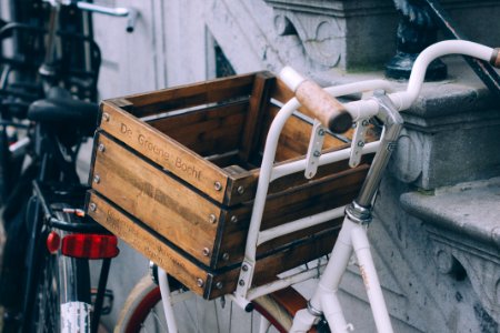 brown wooden crate on white bicycle photo