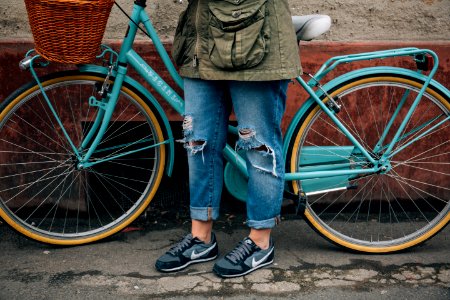 person standing beside bike