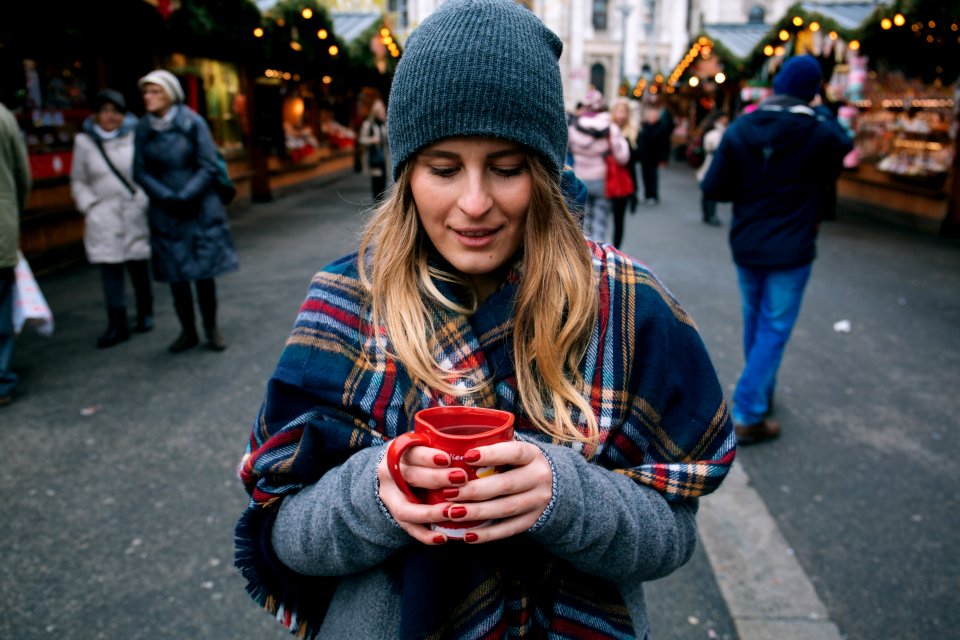 woman holding cup of coffee photo