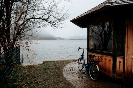 black bicycle near calm body of water photo