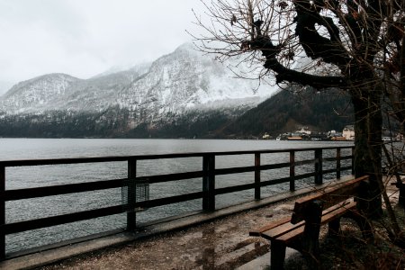 snow covered mountain near body of water during daytime photo