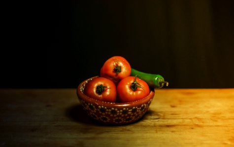 orange fruit on brown woven basket photo