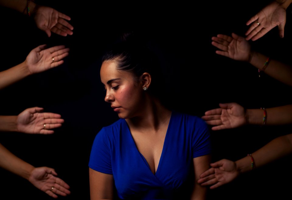 woman wearing blue V-neck short-sleeved top
