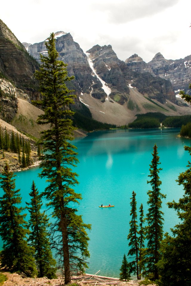 aerial photography of body of water surrounding by mountains
