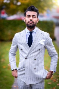 man in white and black pinstripe suit jacket photo