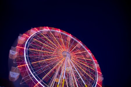 timelapse low angle of white and red ferris wheel photo