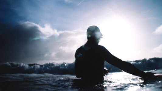 person on sea under blue sky photo