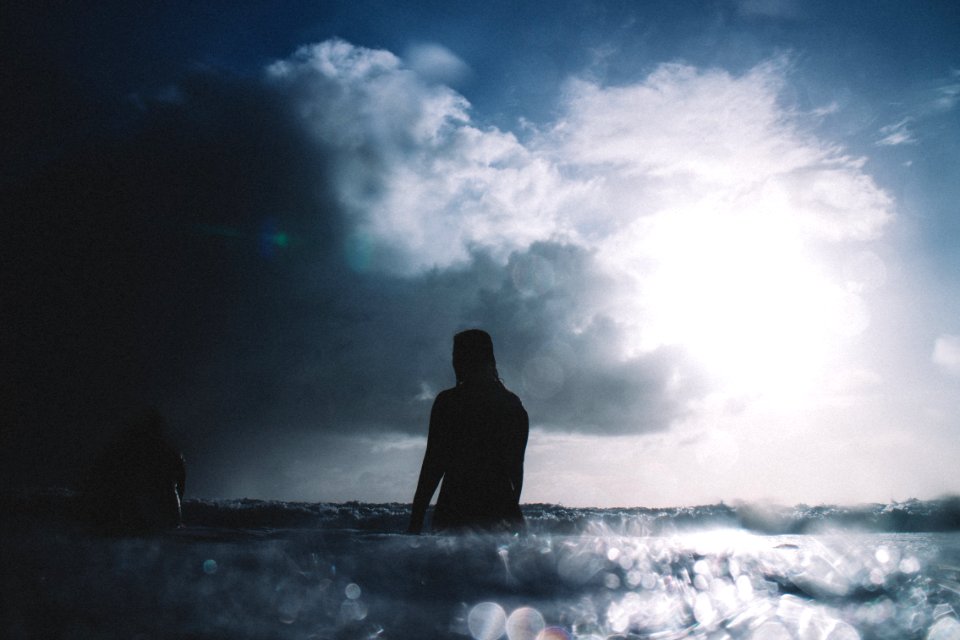 person on body of water during daytime photo