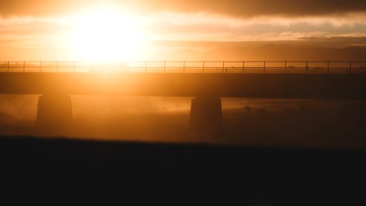 silhouette bridge during sunset
