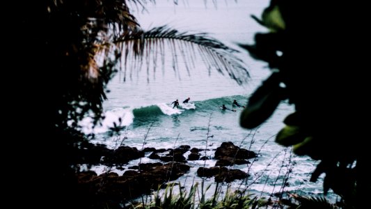 people riding on surfboards