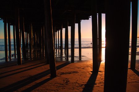 silhouette photo of sea dock