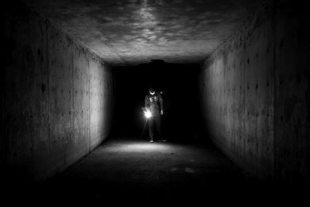 man inside tunnel photo