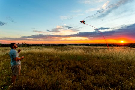 man flying kite photo