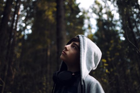 shallow focus photo of man looking at trees photo