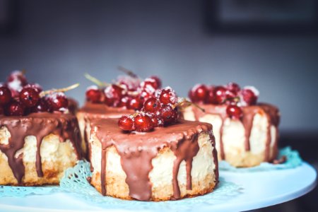 chocolate cake topped with cherries photo