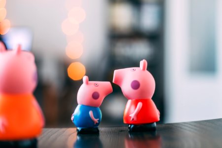 three pink pigs figurines photo