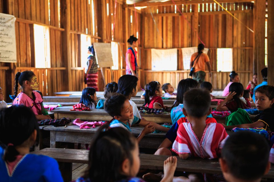 group of toddlers on the school with teacher teaching photo