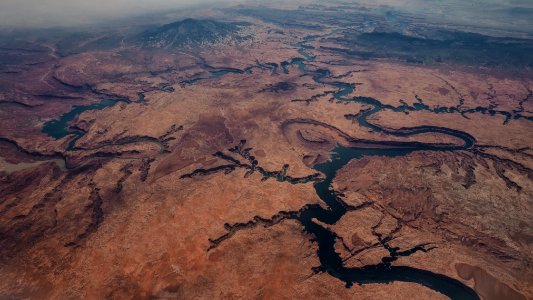 aerial photo of brown mountains and river photo