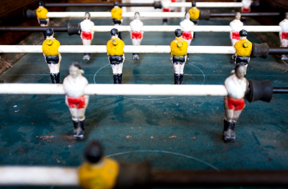selective focus photography foosball table