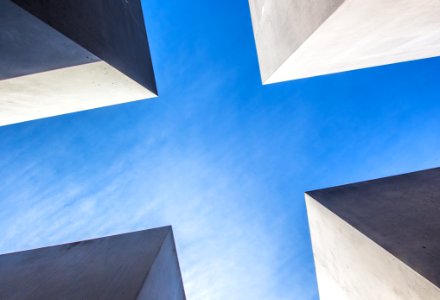 low angle photography of concrete buildings under blue sky photo
