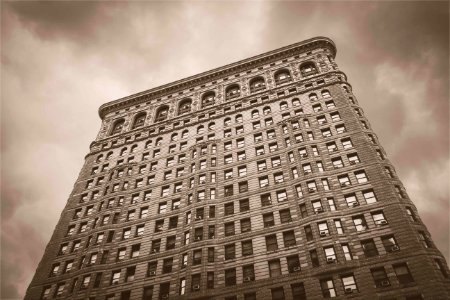 low angle sepia photography of a high-rise building