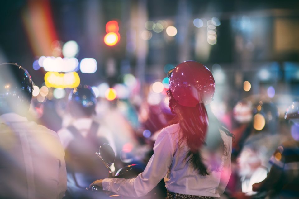 woman ride-on motorcycle beside man