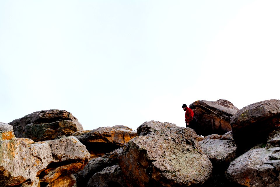 man standing on rocks
