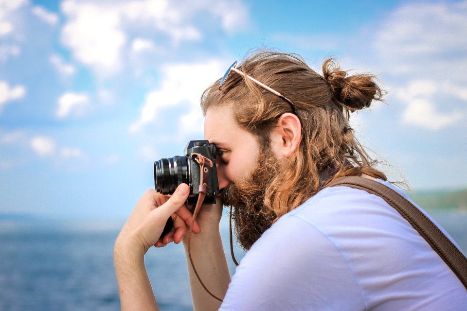 man taking a picture during daytime