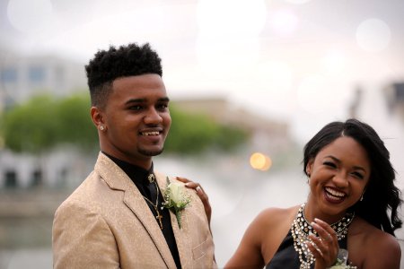 selective focus photography of man taking photo beside woman photo