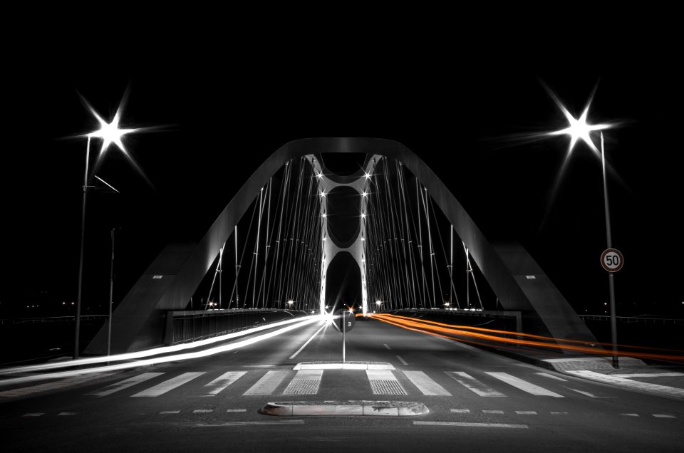 white and black bridge during night time