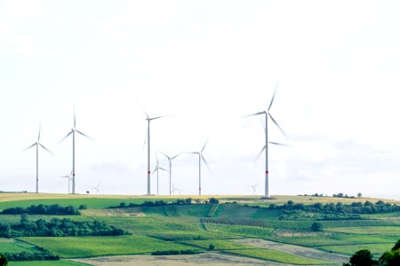 windmill surrounded by grass during daytime photo