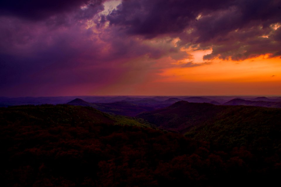 green mountains under cloudy sky during daytime