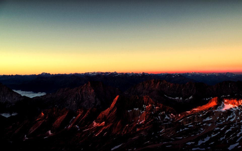 brown rocky mountain during sunset