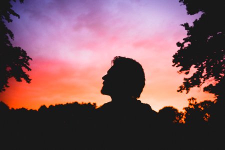 silhouette of man during sunset photo