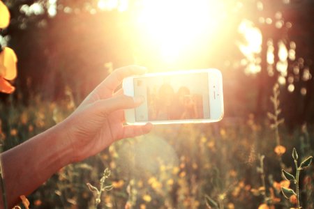 person holding white smartphone photo