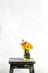 sunflower with clear glass vase on gray table photo