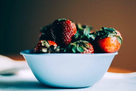 bunch of strawberries in bowl photo