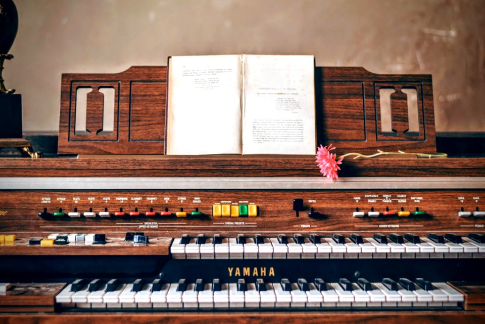 brown Yamaha 2-tier piano photo