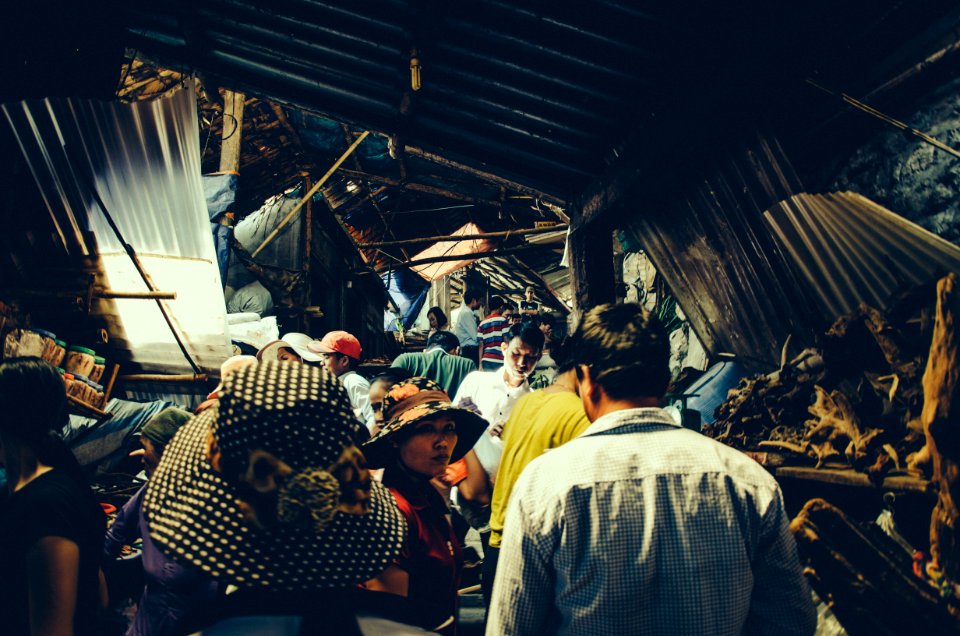 group of people standing inside structure