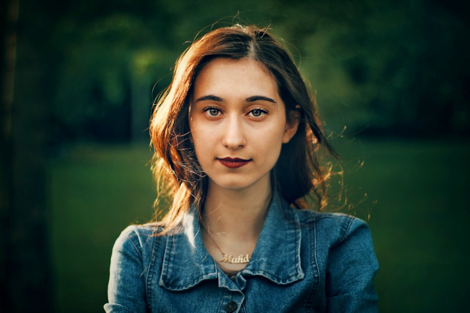 woman wearing blue button-up denim jacket
