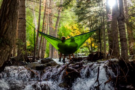 two person on green mesh hammock outdoor photo