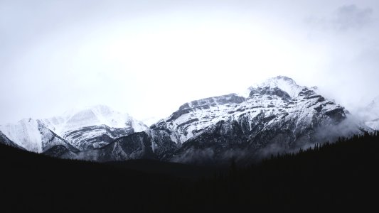 grayscale photography of snow covered mountain photo