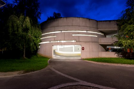 photography of gray concrete building at night time