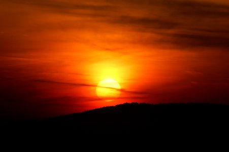silhouette of mountain during orange sunset photo