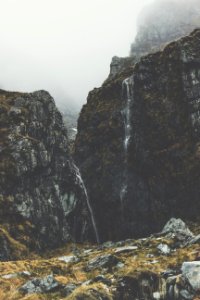 photography of foggy waterfalls photo